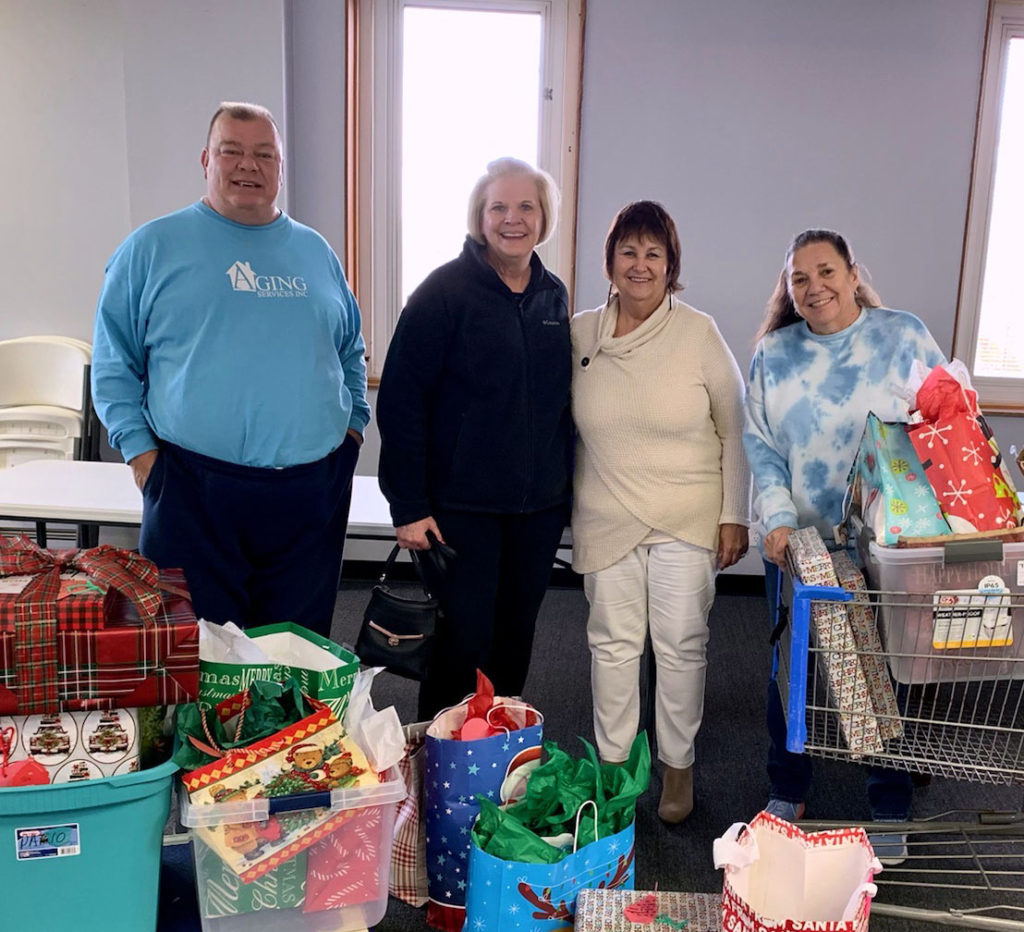 Margaret Luttrell brings gifts from St. Mark's Catholic Church! Aging